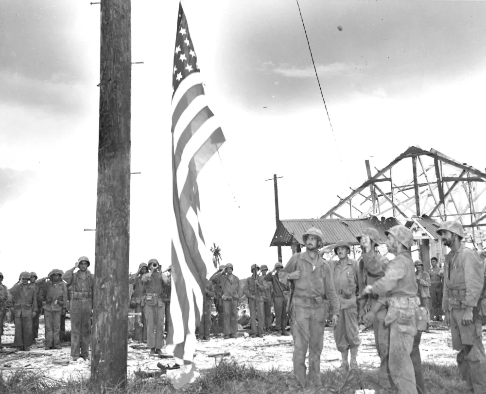 U.S. Marines raise the American flag on Guam, July 1944
